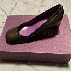 Brand new, never worn, brown leather wedges.